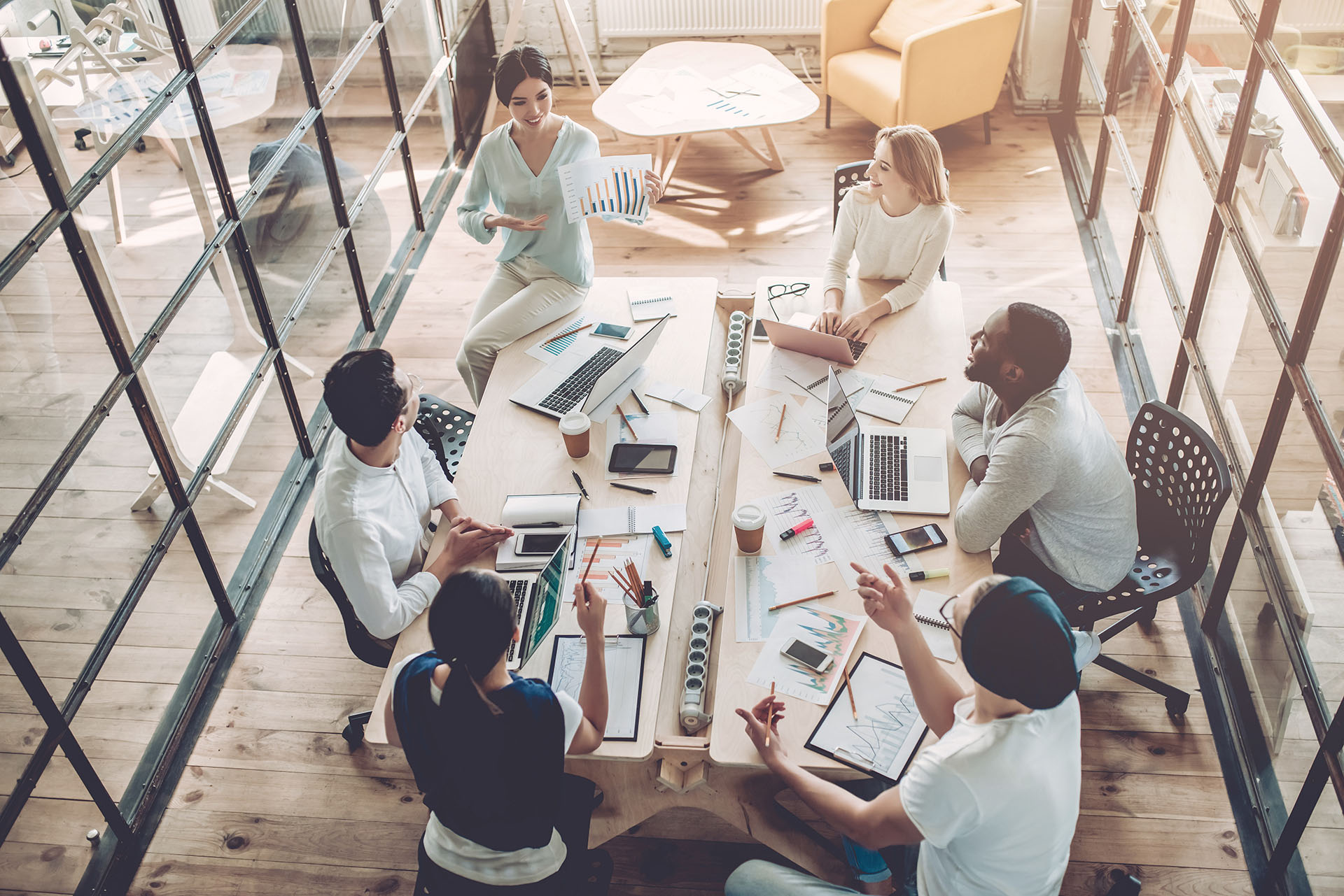 A team of professionals in a meeting working on influencer marketing strategy